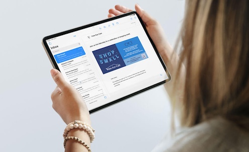 Shop Small graphic displayed on digital tabled held by feminine hands